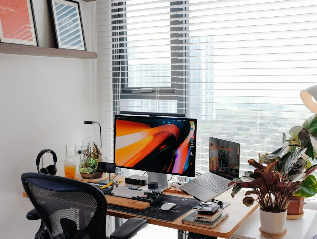 A colourful modern workspace with computer equipment